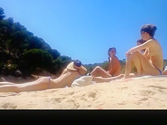 Topless friends at river beach