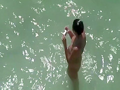 Nude woman takes pictures of her naked man