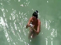 Nude woman takes pictures of her naked man