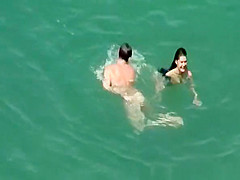 Hot woman sunbathing in beach