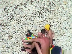 Nudist redhead swimming in the water