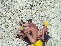 Nudist redhead swimming in the water