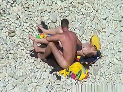 Nudist redhead swimming in the water