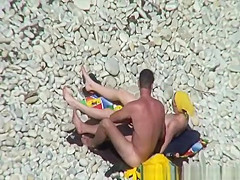 Nudist redhead swimming in the water