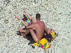 Nudist redhead swimming in the water