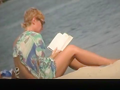 Busty topless in nudist beach