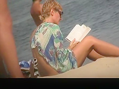 Busty topless in nudist beach
