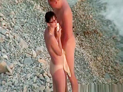 Hairy pussy nudist with glasses in the water