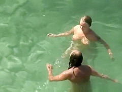 Chubby nudist woman with tattooed arm