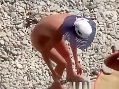 Nude couple enjoying the cool water