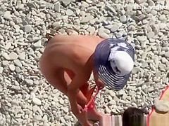 Nude couple enjoying the cool water