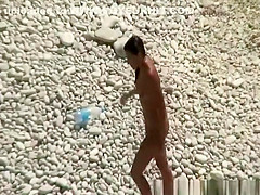 Nudist brunette woman sunbathing
