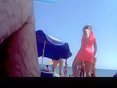 Voyeur films woman taking off her dress