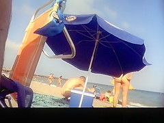 Voyeur films woman taking off her dress