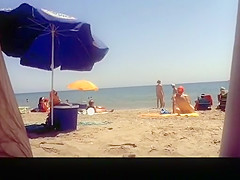 Voyeur films woman taking off her dress