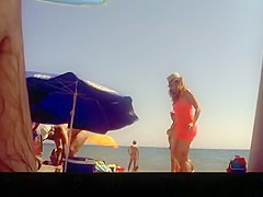Voyeur films woman taking off her dress
