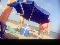 Voyeur films woman taking off her dress