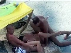 Horny swingers enjoying it on the beach