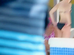 Teen rubs herself with lotion by the pool
