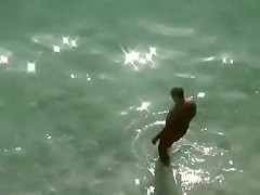 Spy a couple fuck on an isolated beach