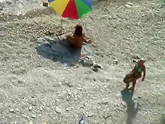 Spy a couple fuck on an isolated beach