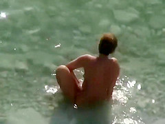 Spy a couple fuck on an isolated beach