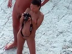 Fat hubby and fit wife on the beach