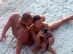 Fat hubby and fit wife on the beach