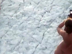 Fat hubby and fit wife on the beach