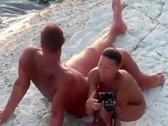 Fat hubby and fit wife on the beach