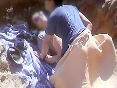 Shy couple fucking on a beach
