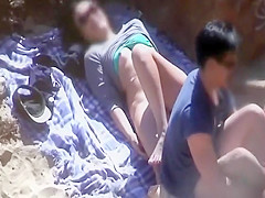 Shy couple fucking on a beach