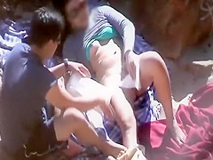 Shy couple fucking on a beach