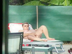 Milf thinks she's all alone at a pool