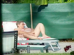 Milf thinks she's all alone at a pool