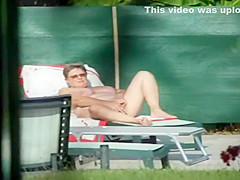 Milf thinks she's all alone at a pool