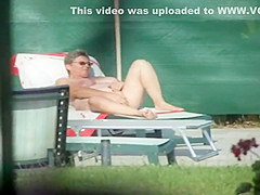 Milf thinks she's all alone at a pool