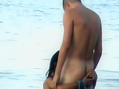 Wild fuck in the water caught by a voyeur