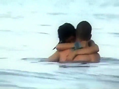 Wild fuck in the water caught by a voyeur