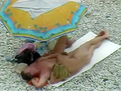 Sexy milf lying next to her man