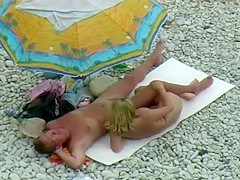 Sexy milf lying next to her man