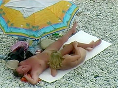 Sexy milf lying next to her man