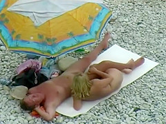 Sexy milf lying next to her man