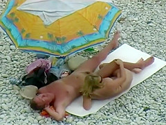 Sexy milf lying next to her man