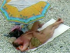 Sexy milf lying next to her man