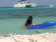 Topless sisters spied on an air mattress