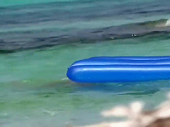 Topless sisters spied on an air mattress