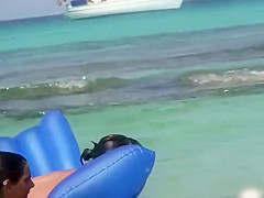 Topless sisters spied on an air mattress