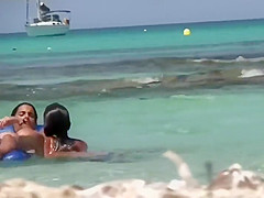 Topless sisters spied on an air mattress