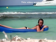 Topless sisters spied on an air mattress